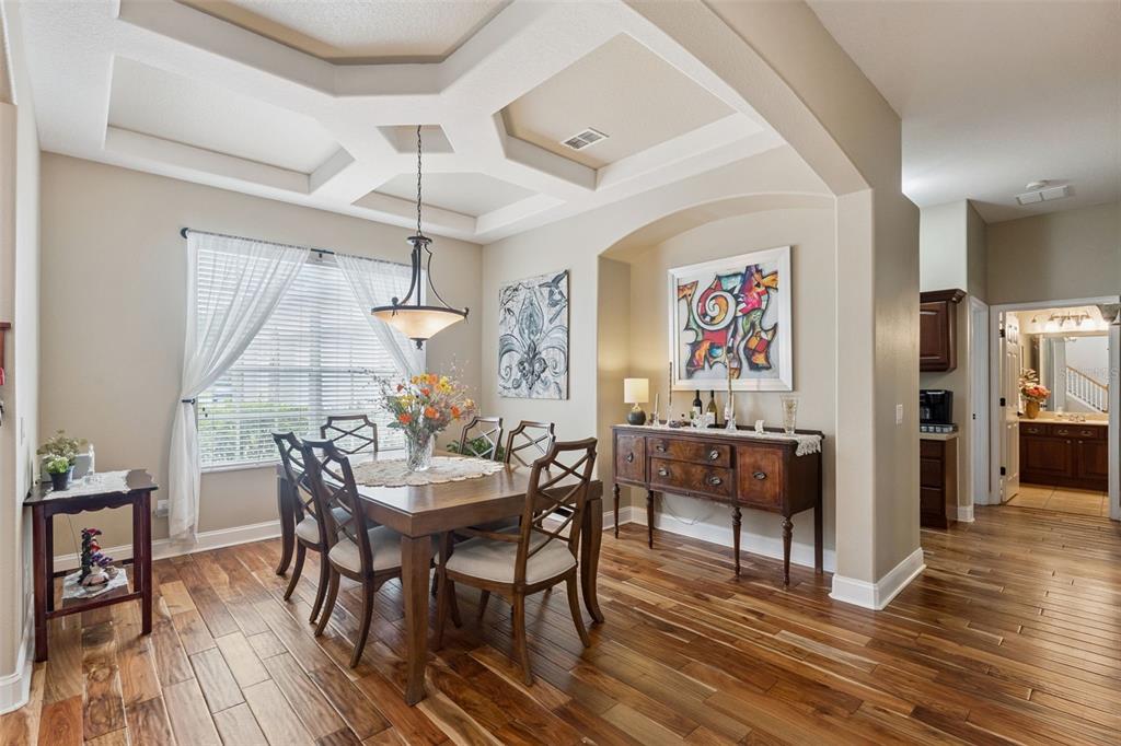 216 Juniper Ridge Court Sanford, FL 32771 - Photo 24 of 61 a view of a dining room with furniture window and wooden floor