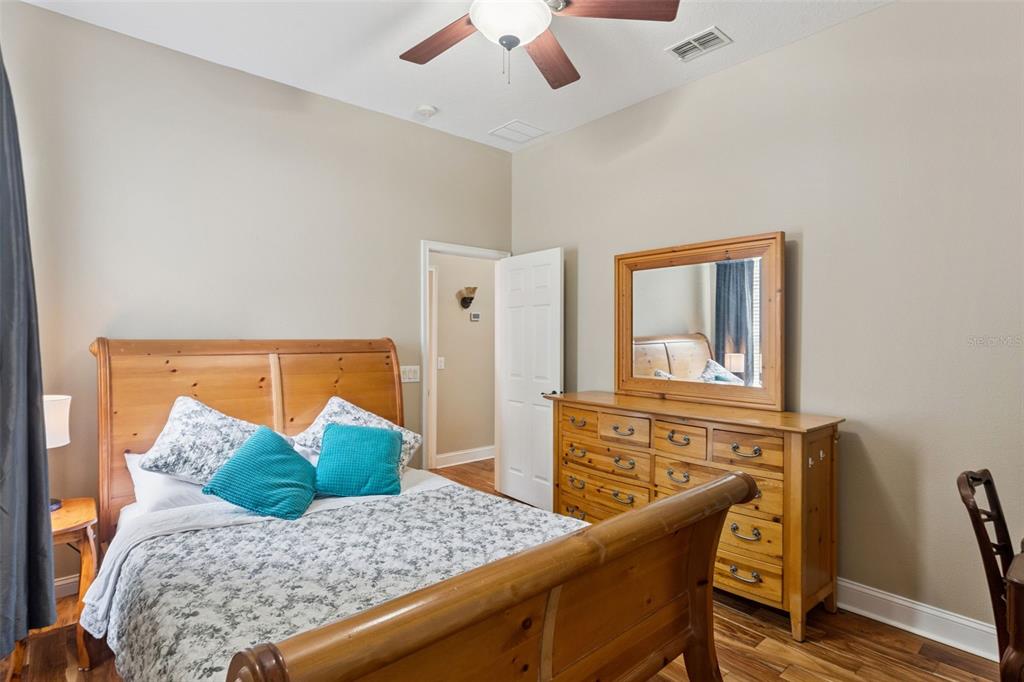 216 Juniper Ridge Court Sanford, FL 32771 - Photo 28 of 61 a bedroom with a bed and dresser