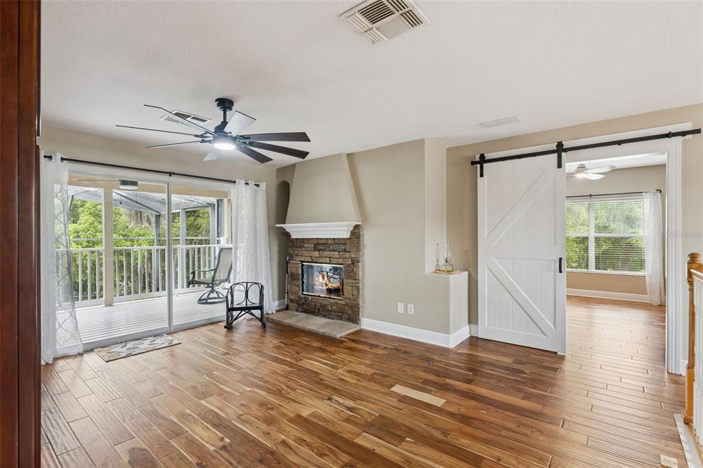 216 Juniper Ridge Court Sanford, FL 32771 - Photo 36 of 61 a view of empty room with wooden floor and fan