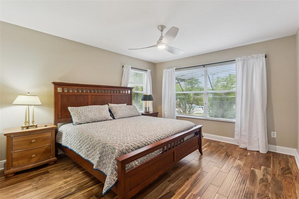 216 Juniper Ridge Court Sanford, FL 32771 - Photo 39 of 61 a large bed sitting in a bedroom next to a window