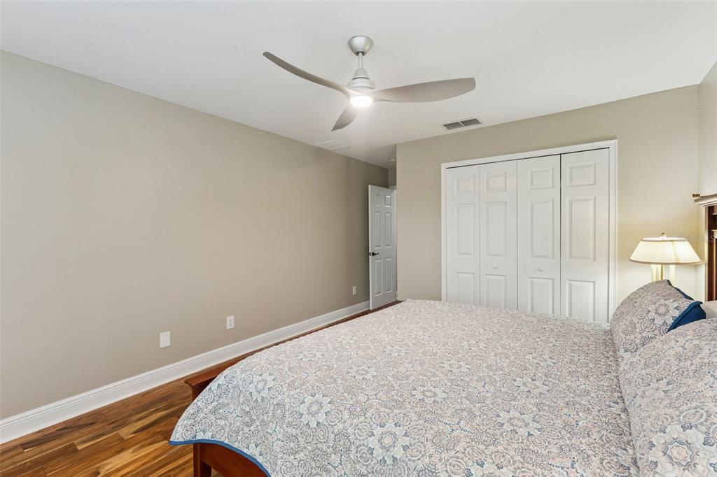 216 Juniper Ridge Court Sanford, FL 32771 - Photo 40 of 61 a bedroom with a bed and a ceiling fan