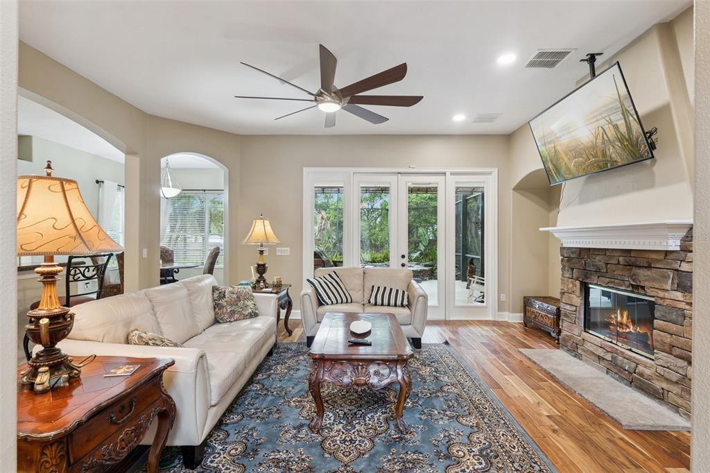 216 Juniper Ridge Court Sanford, FL 32771 - Photo 4 of 61 a living room with furniture fireplace and a large window