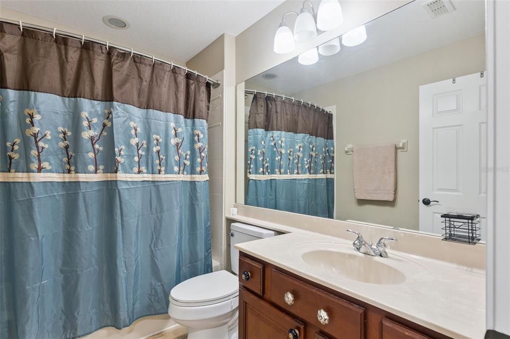 216 Juniper Ridge Court Sanford, FL 32771 - Photo 42 of 61 a bathroom with a sink a toilet and shower