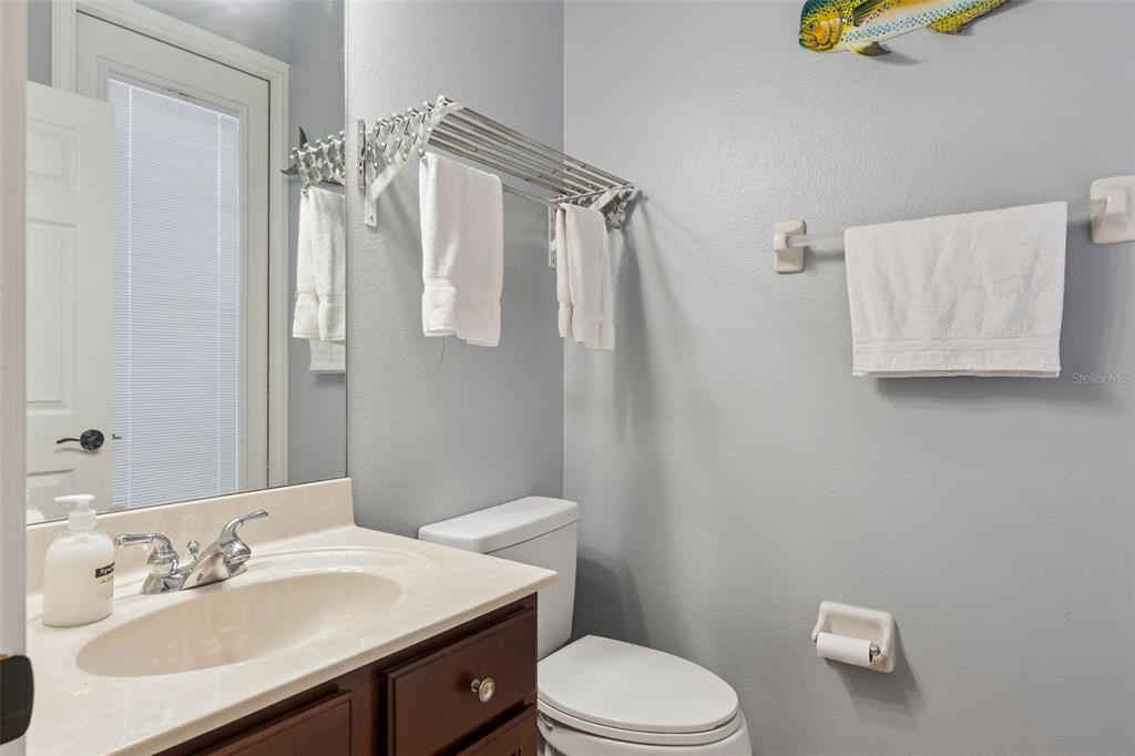216 Juniper Ridge Court Sanford, FL 32771 - Photo 45 of 61 a bathroom with a sink vanity mirror and toilet