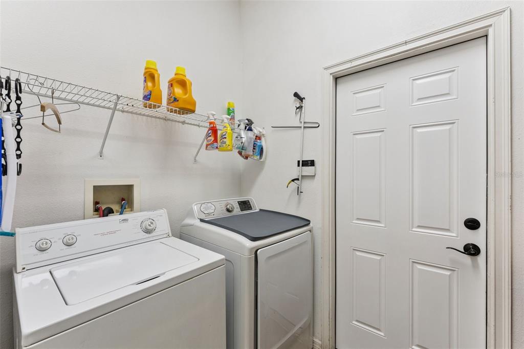 216 Juniper Ridge Court Sanford, FL 32771 - Photo 46 of 61 a view of storage and utility room with washer and dryer