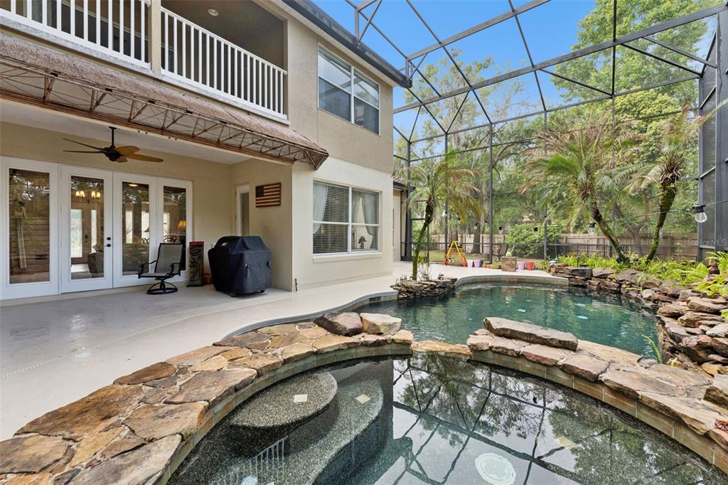 216 Juniper Ridge Court Sanford, FL 32771 - Photo 10 of 61 a view of a swimming pool with lounge chairs in patio