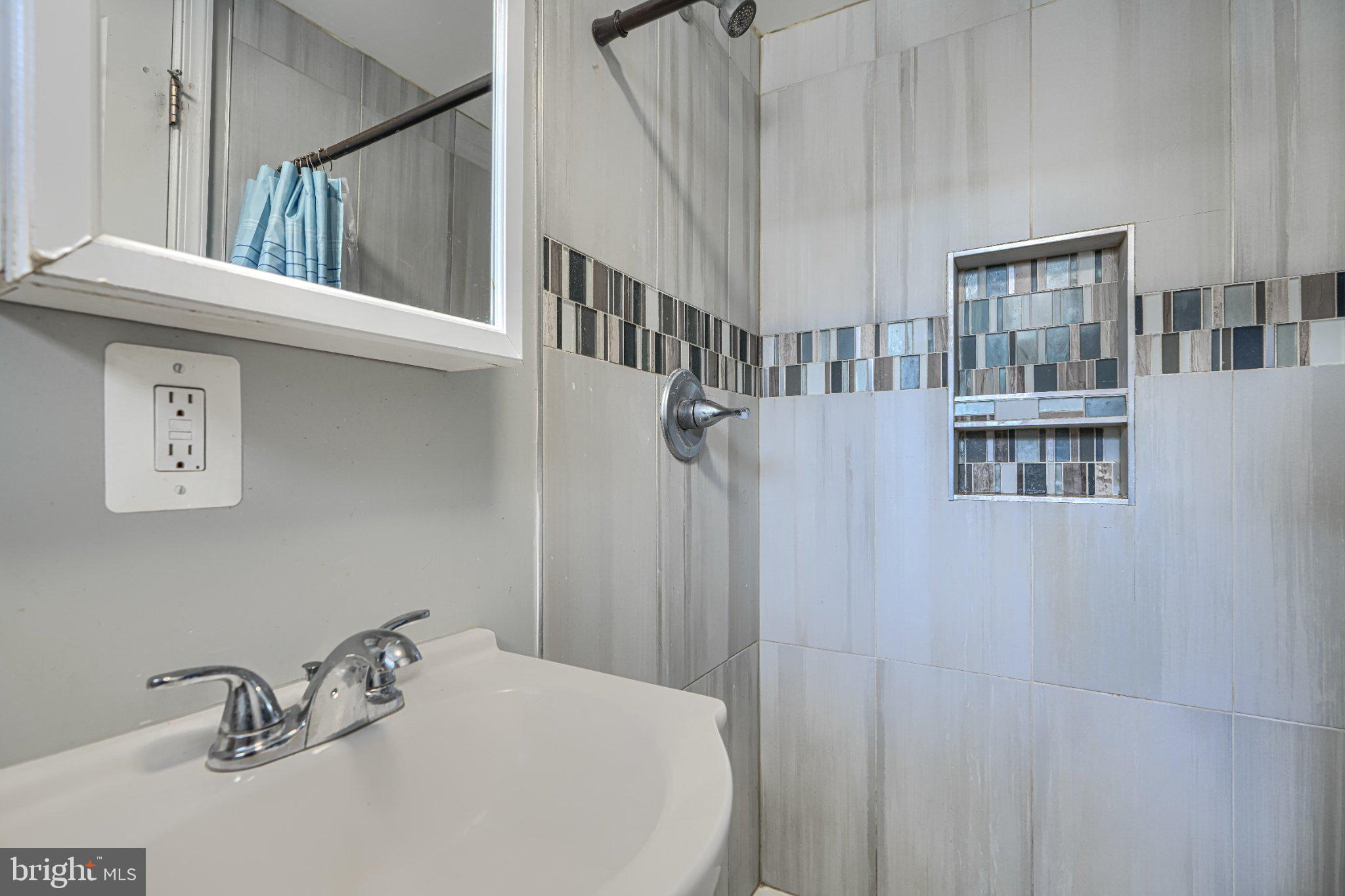1639 Walterswood Road Baltimore, MD 21239 - Photo 41 of 49 Modern shower with stylish tile accents.