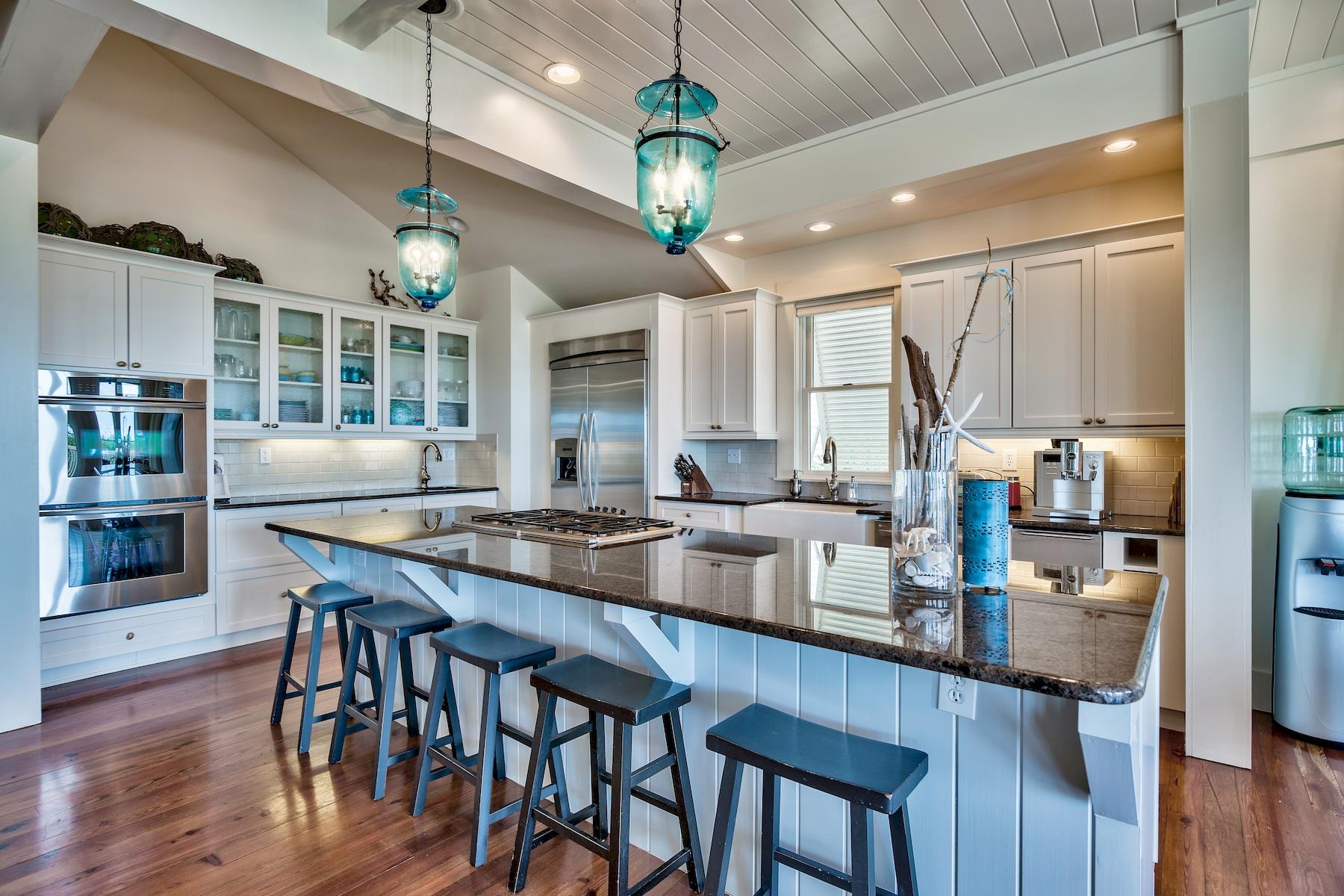 369 Old Beach Road Santa Rosa Beach, FL 32459 - Photo 7 of 50 a large kitchen with a table and chairs