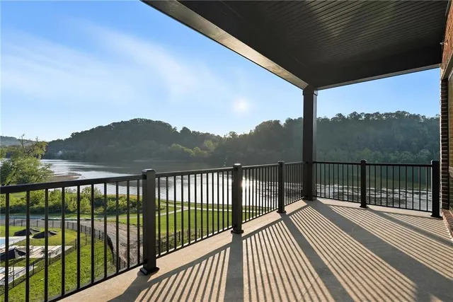 a view of a balcony with wooden floor and city view