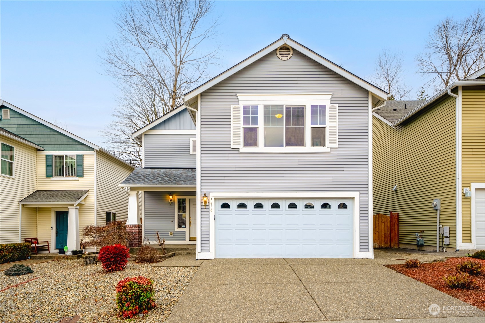 a front view of a house with outdoor seating