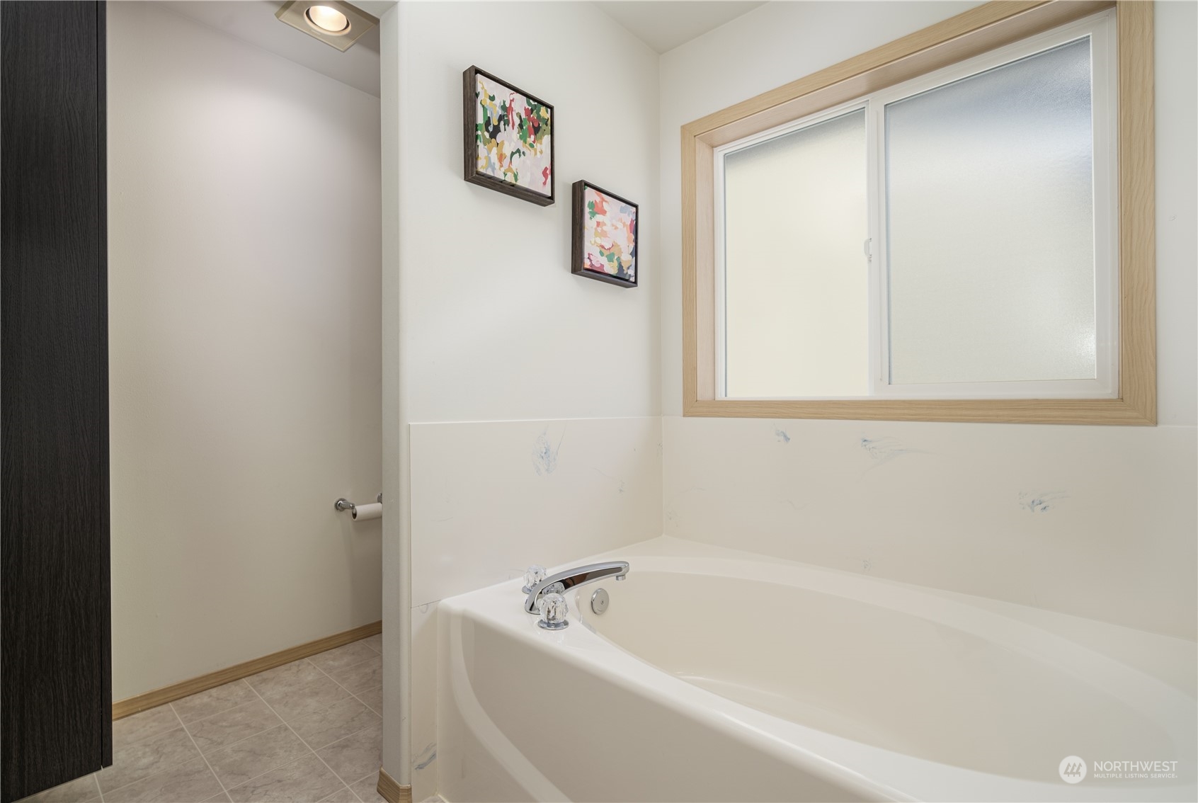 2630 Northeast 2nd Street Renton, WA 98056 - Photo 11 of 19 a white bath tub sitting next to a small window