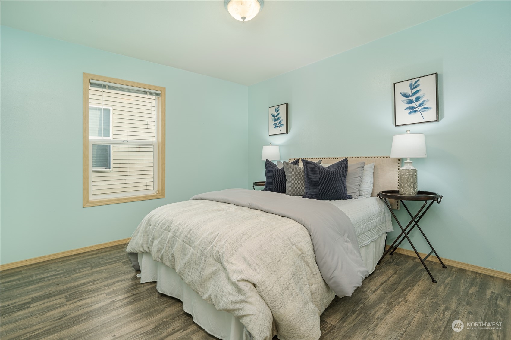 2630 Northeast 2nd Street Renton, WA 98056 - Photo 14 of 19 a bedroom with a bed and wooden floor