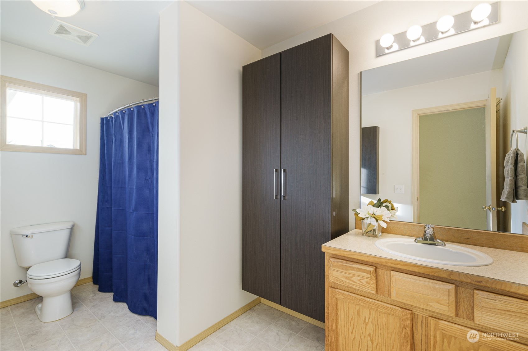 2630 Northeast 2nd Street Renton, WA 98056 - Photo 15 of 19 a bathroom with a toilet sink and mirror