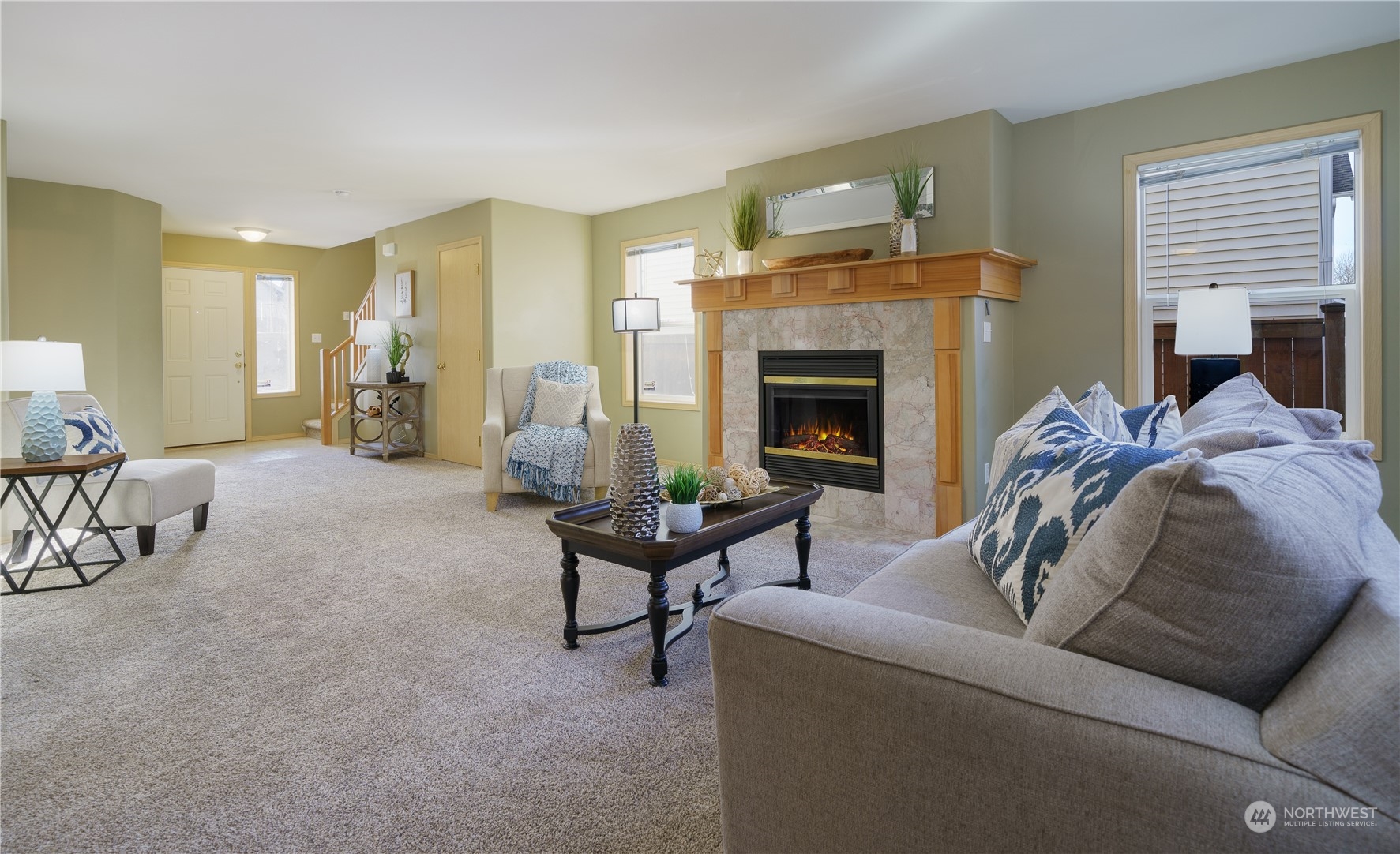 2630 Northeast 2nd Street Renton, WA 98056 - Photo 3 of 19 a living room with furniture and a fireplace