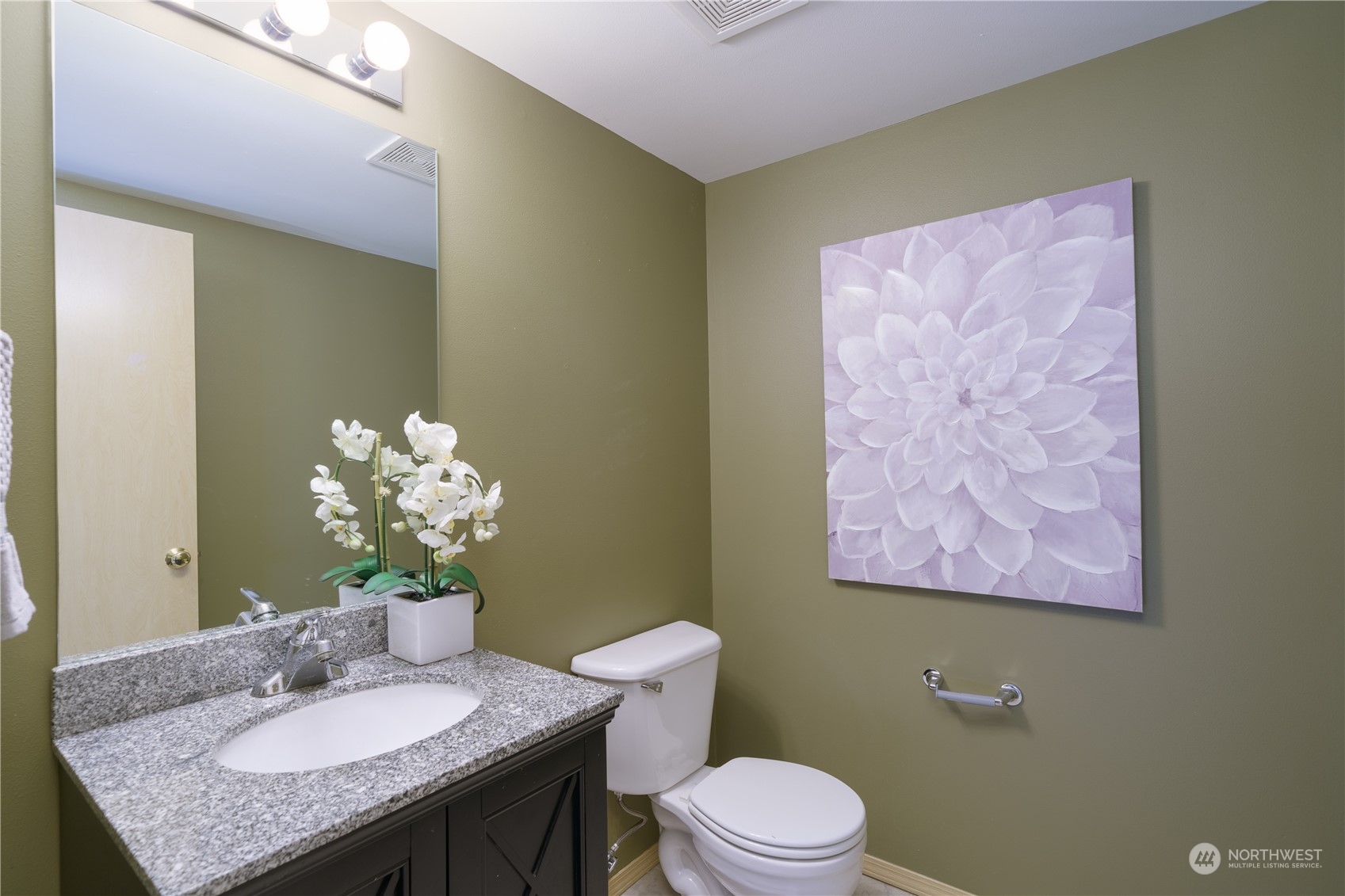 2630 Northeast 2nd Street Renton, WA 98056 - Photo 6 of 19 a bathroom with a granite countertop sink a toilet and mirror