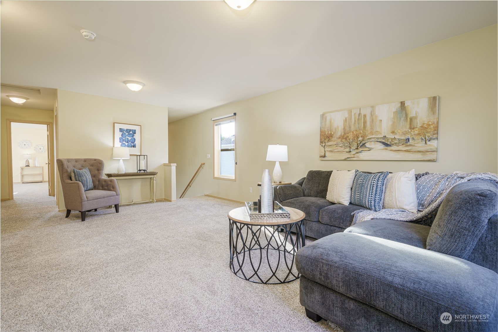 2630 Northeast 2nd Street Renton, WA 98056 - Photo 7 of 19 a living room with furniture and a chandelier