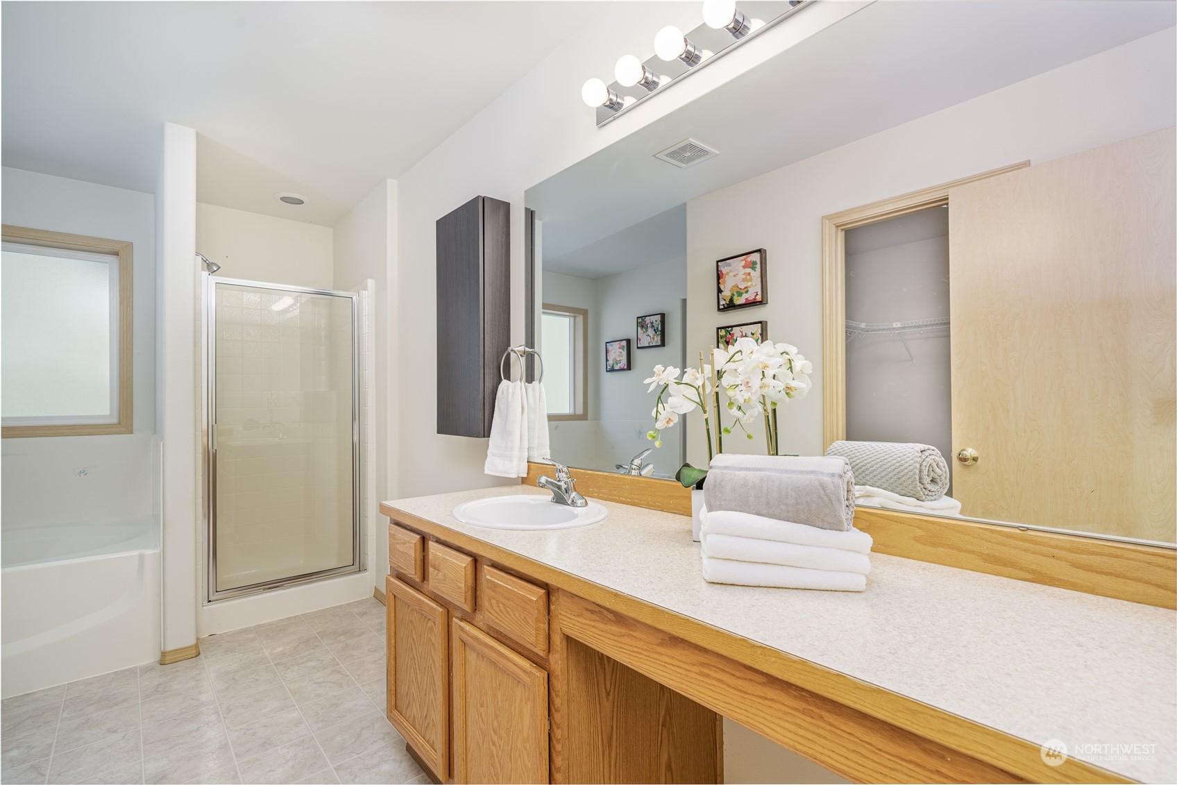 2630 Northeast 2nd Street Renton, WA 98056 - Photo 10 of 19 a spacious bathroom with a granite countertop sink and a mirror