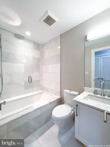 a bathroom with a sink a toilet and bathtub