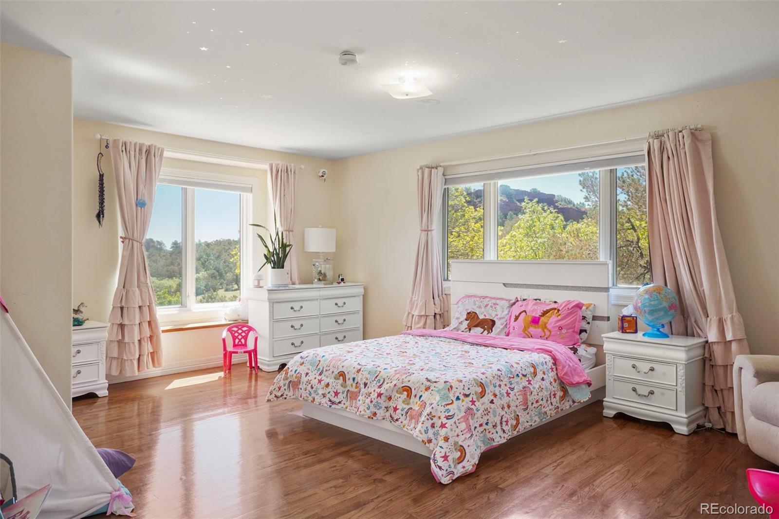 15010 Henry Ride Heights Colorado Springs, CO 80926 - Photo 18 of 50 a bedroom with a bed and a window