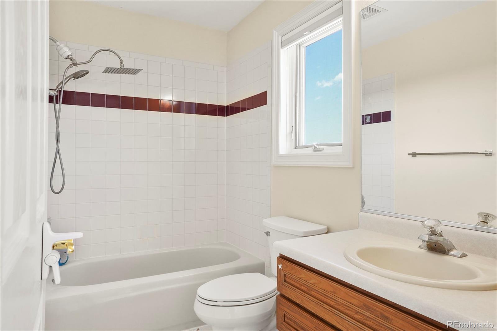 15010 Henry Ride Heights Colorado Springs, CO 80926 - Photo 19 of 50 a bathroom with a sink toilet and shower