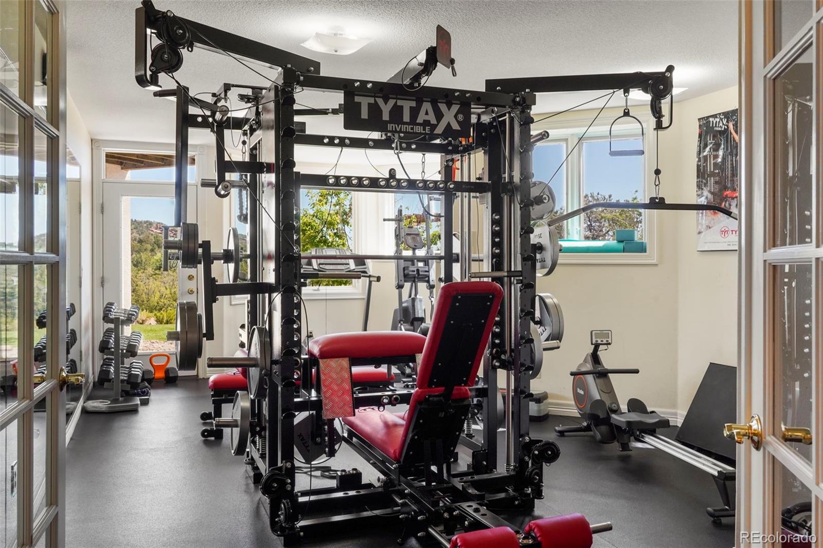 15010 Henry Ride Heights Colorado Springs, CO 80926 - Photo 23 of 50 a view of a room with gym equipment