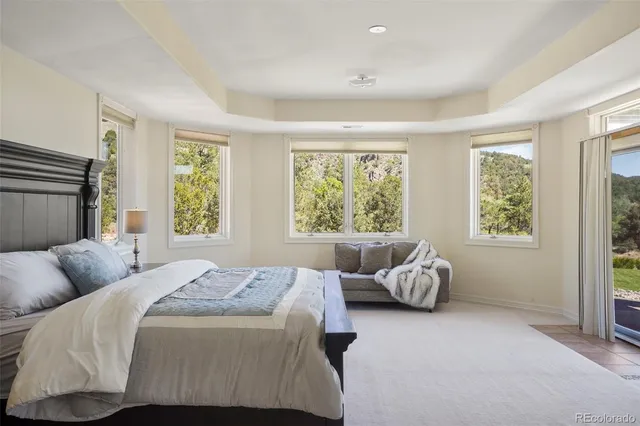 a bedroom with bed and window