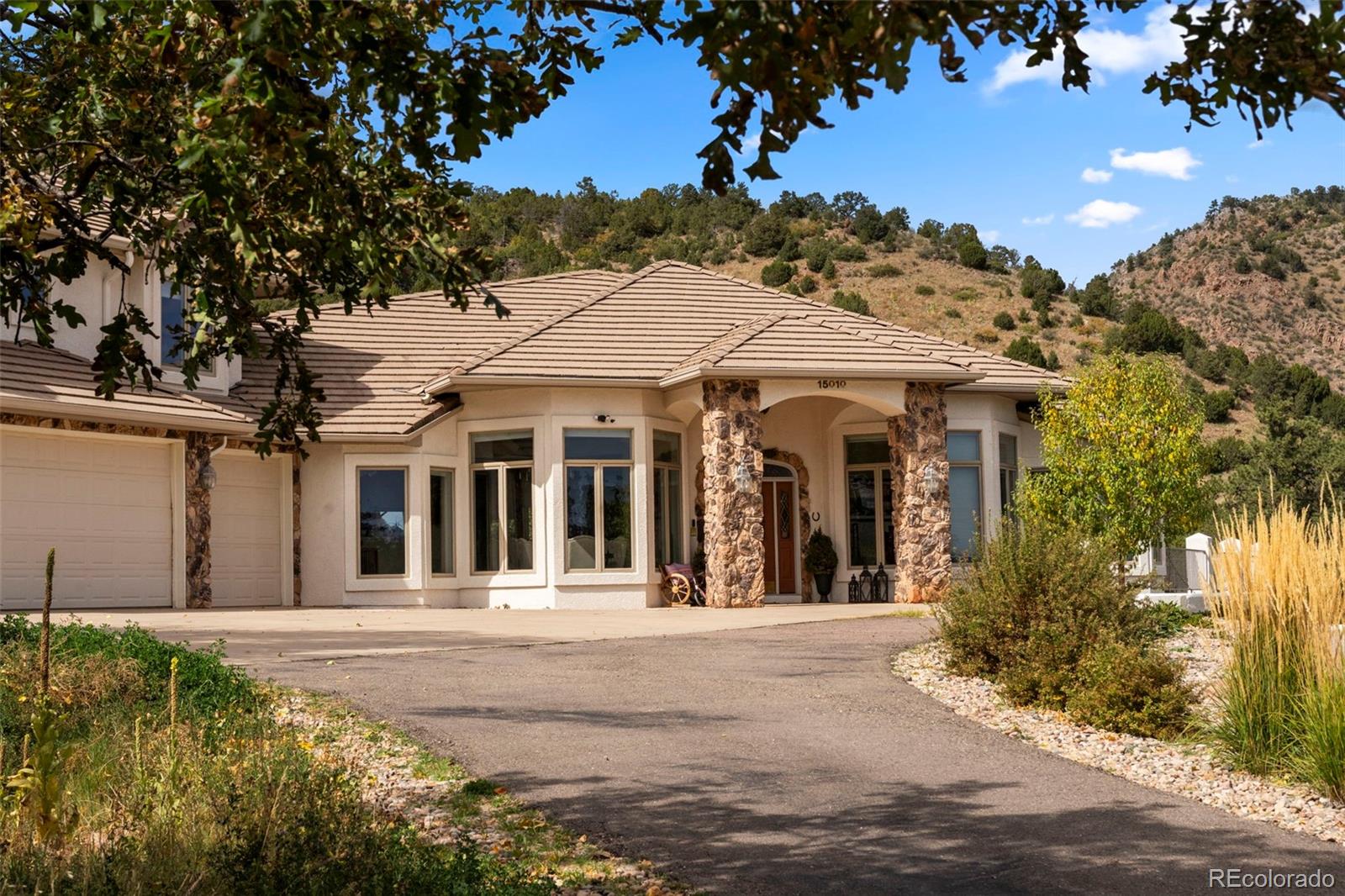 15010 Henry Ride Heights Colorado Springs, CO 80926 - Photo 3 of 50 front view of a house with a porch