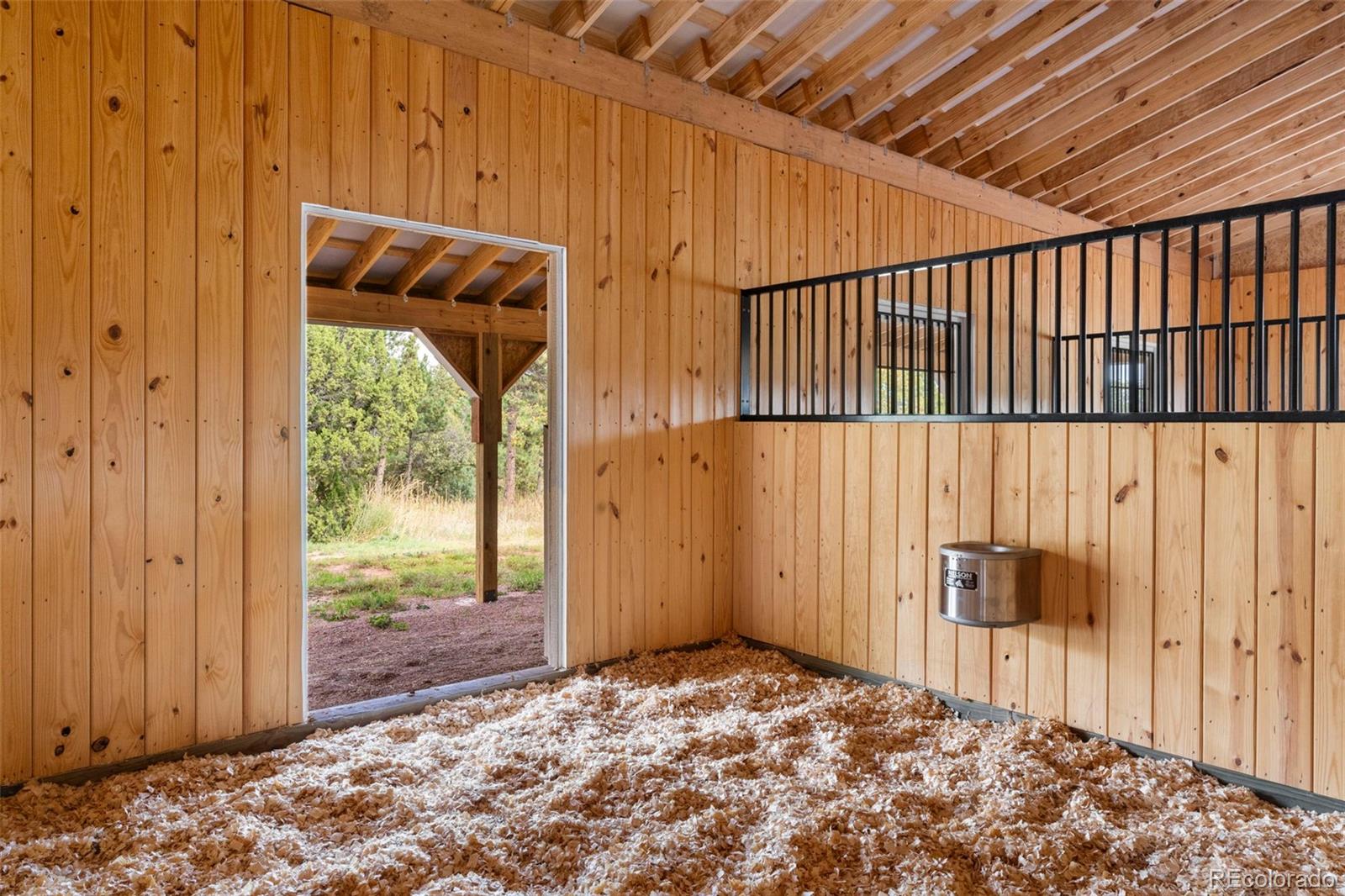 15010 Henry Ride Heights Colorado Springs, CO 80926 - Photo 38 of 50 a view of a back yard from a room