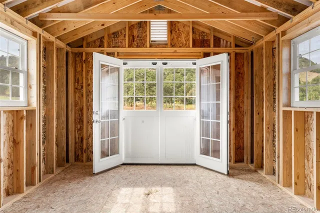 a view of an empty room with windows