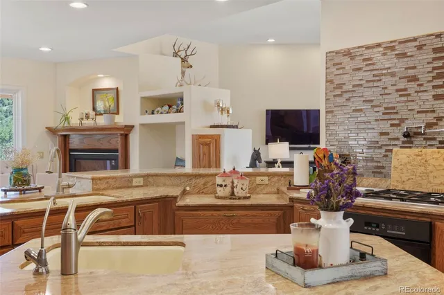 a living room with fireplace furniture and a flat screen tv