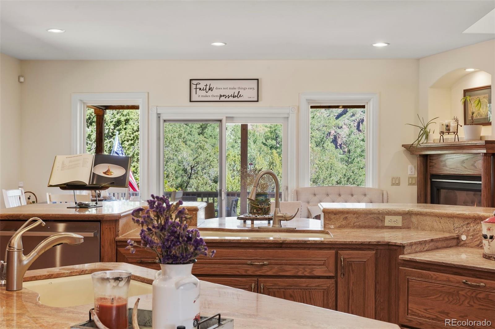 15010 Henry Ride Heights Colorado Springs, CO 80926 - Photo 8 of 50 a kitchen with sink refrigerator and large window