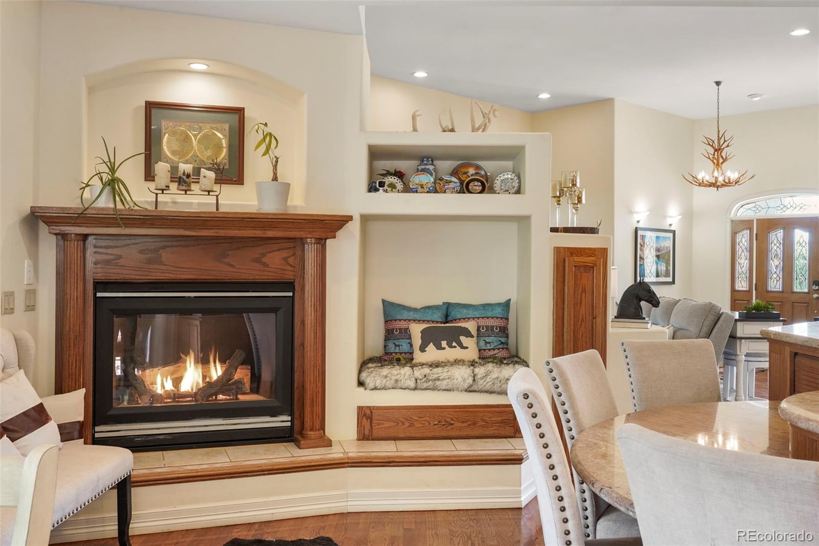 15010 Henry Ride Heights Colorado Springs, CO 80926 - Photo 9 of 50 a living room with furniture and a fireplace