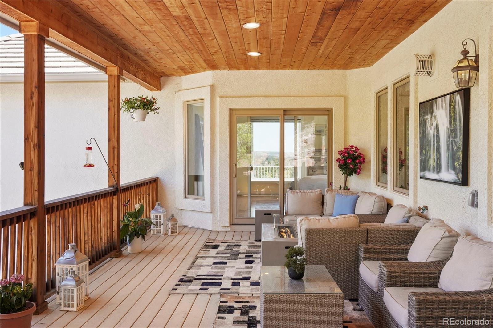 15010 Henry Ride Heights Colorado Springs, CO 80926 - Photo 10 of 50 a living room with furniture and a table