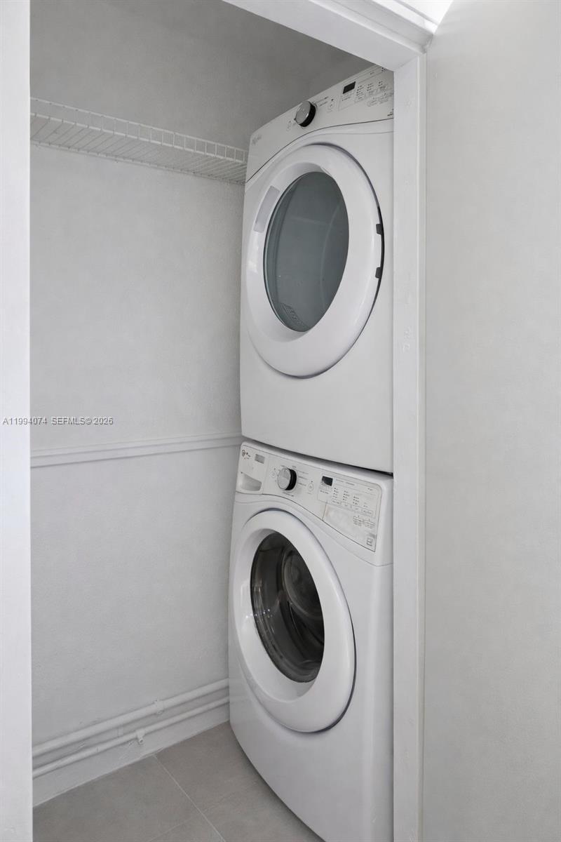 1950 Northwest 57th Street, Unit 1950 Miami, FL 33142 - Photo 7 of 10 a utility room with dryer and washer
