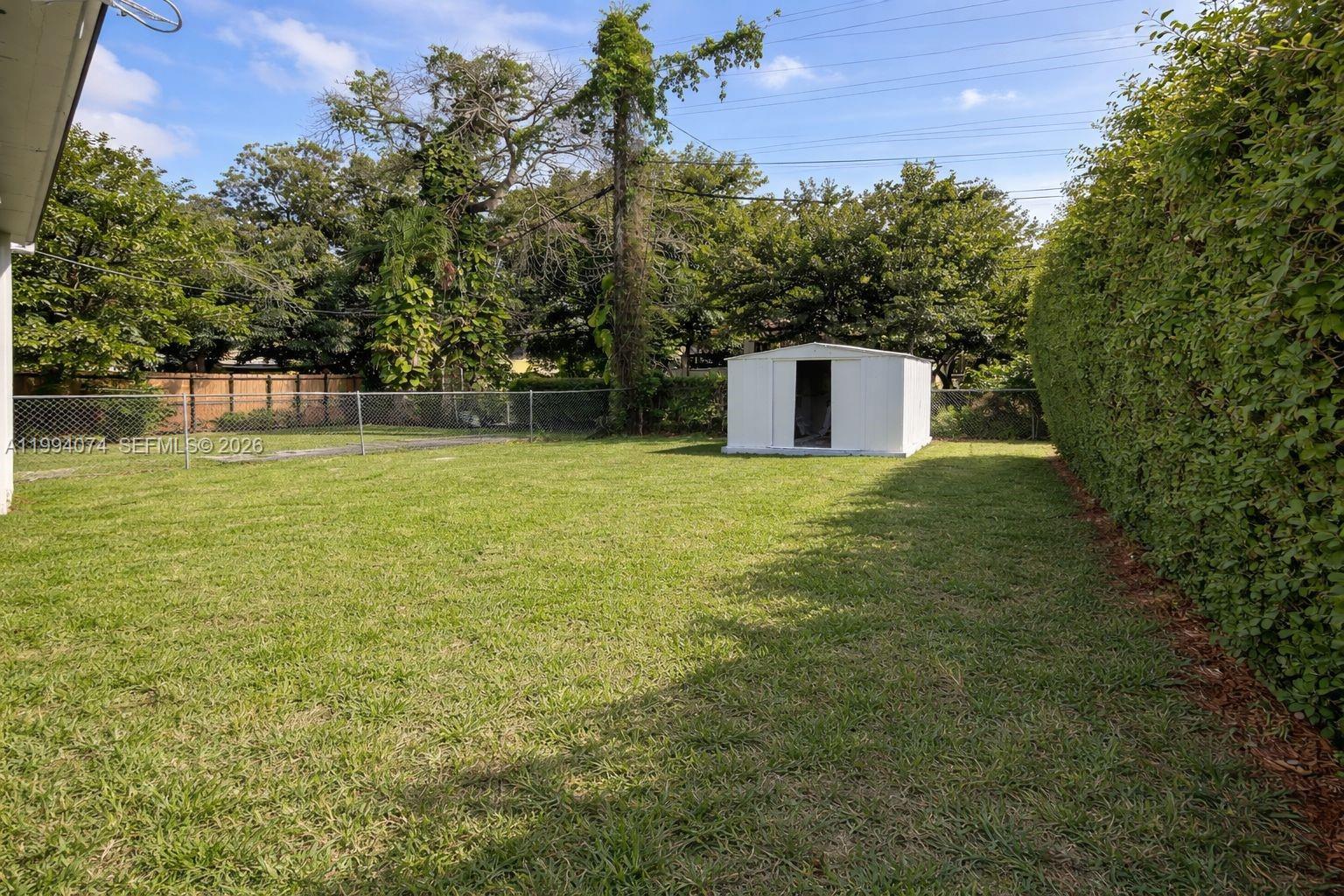 1950 Northwest 57th Street, Unit 1950 Miami, FL 33142 - Photo 10 of 10 a house with a yard
