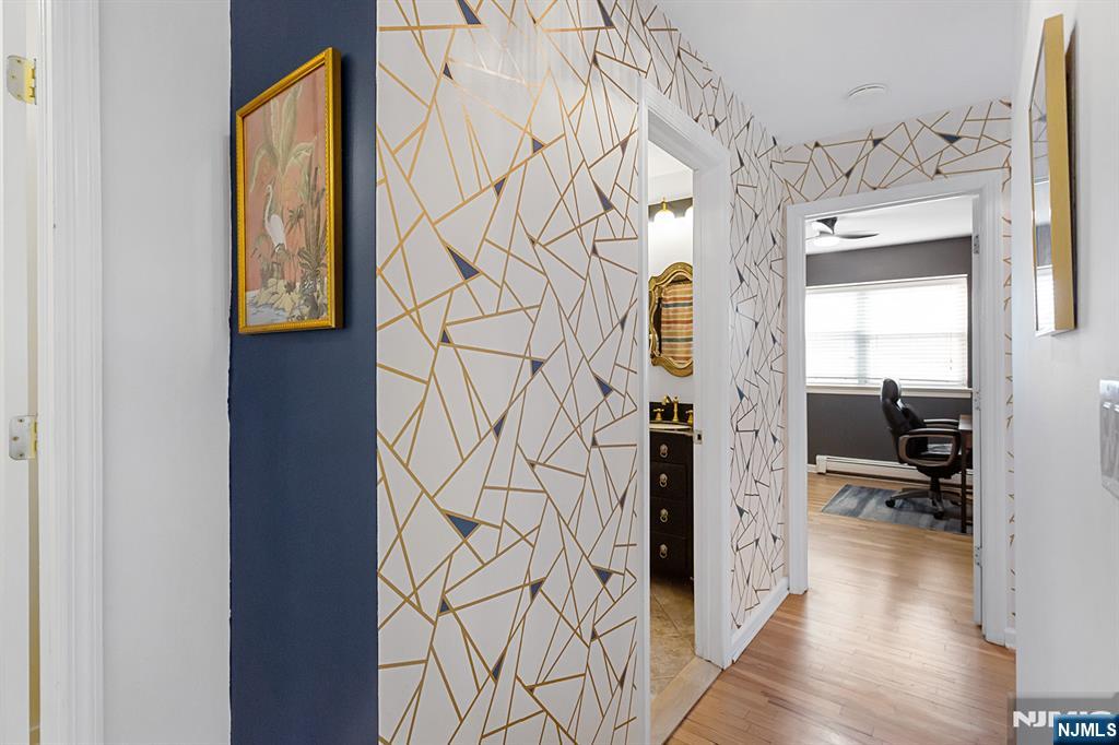 25 River Road, Unit B11 Nutley, NJ 07110 - Photo 15 of 30 a view of a hallway with wooden floor and windows