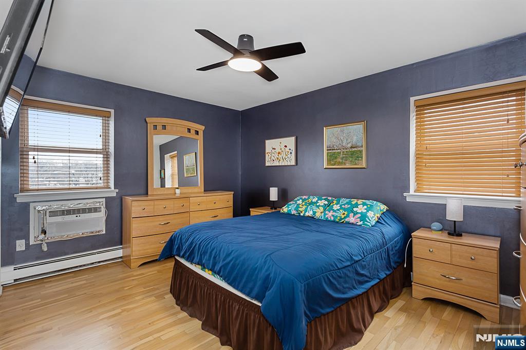 25 River Road, Unit B11 Nutley, NJ 07110 - Photo 19 of 30 a bedroom with a bed and a dresser