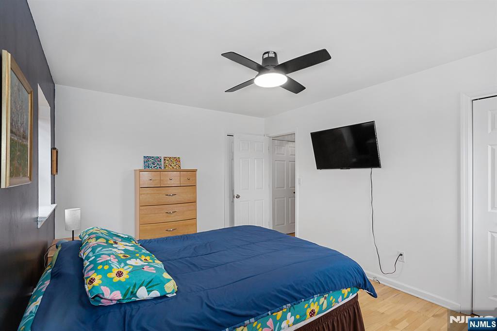 25 River Road, Unit B11 Nutley, NJ 07110 - Photo 20 of 30 a bedroom with a bed and a tv