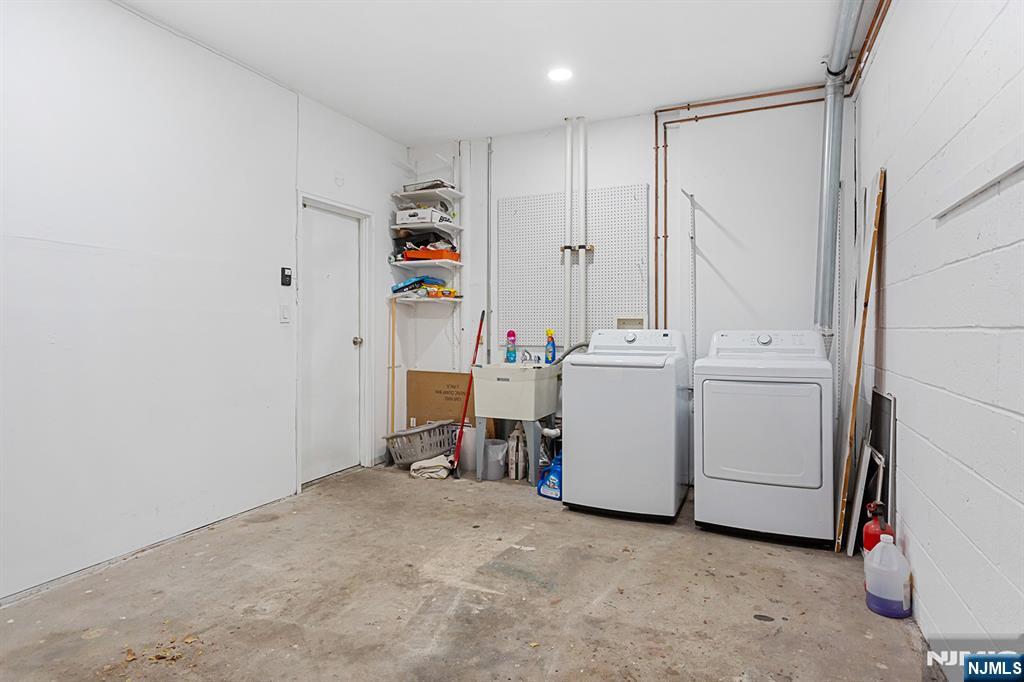 25 River Road, Unit B11 Nutley, NJ 07110 - Photo 27 of 30 a utility room with dryer and washer