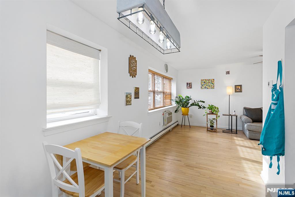 25 River Road, Unit B11 Nutley, NJ 07110 - Photo 9 of 30 a living room with furniture and a window
