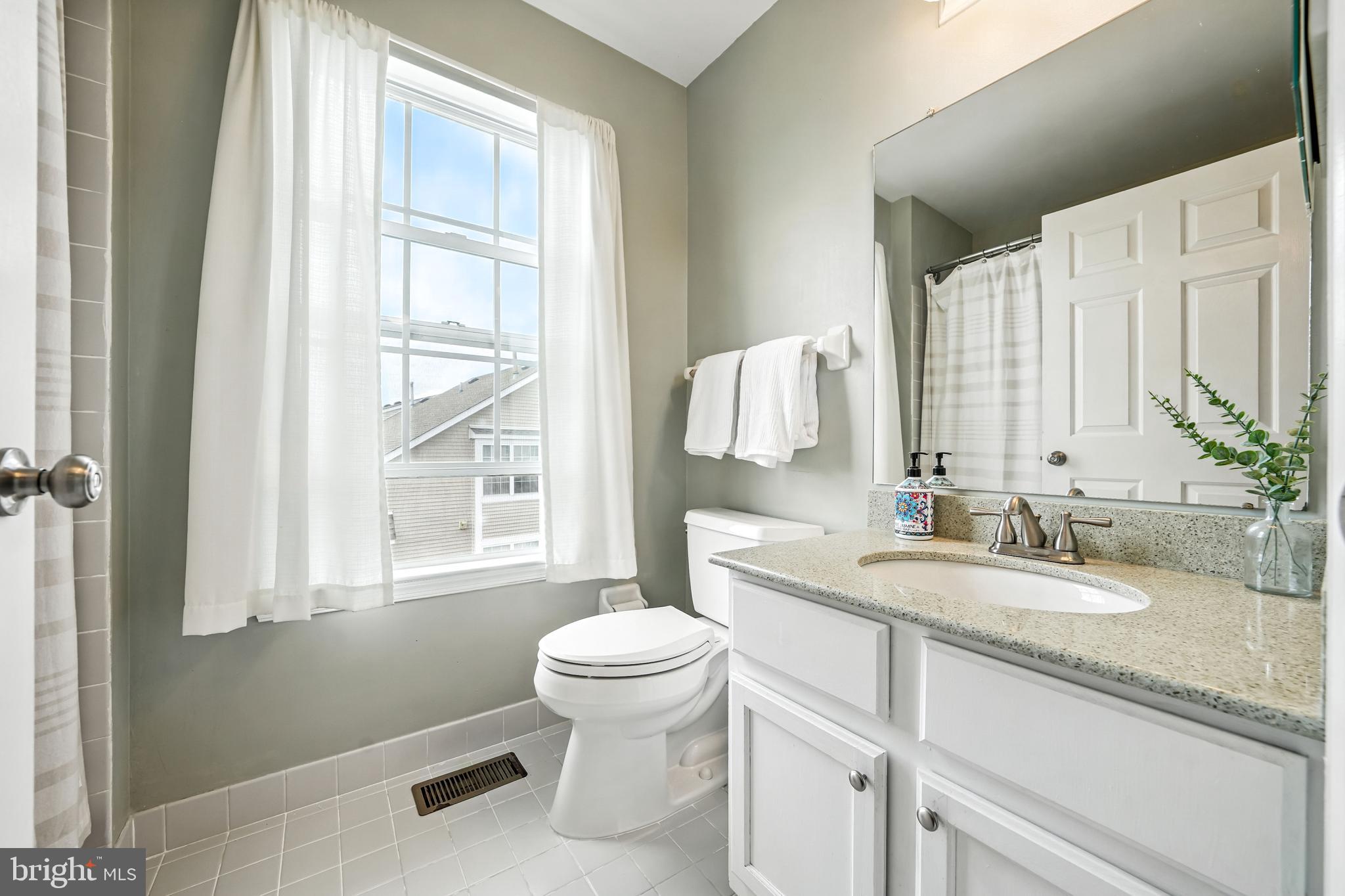 1501 Deborah Court, Unit 2102 Jamison, PA 18929 - Photo 12 of 21 a bathroom with a granite countertop sink toilet and mirror