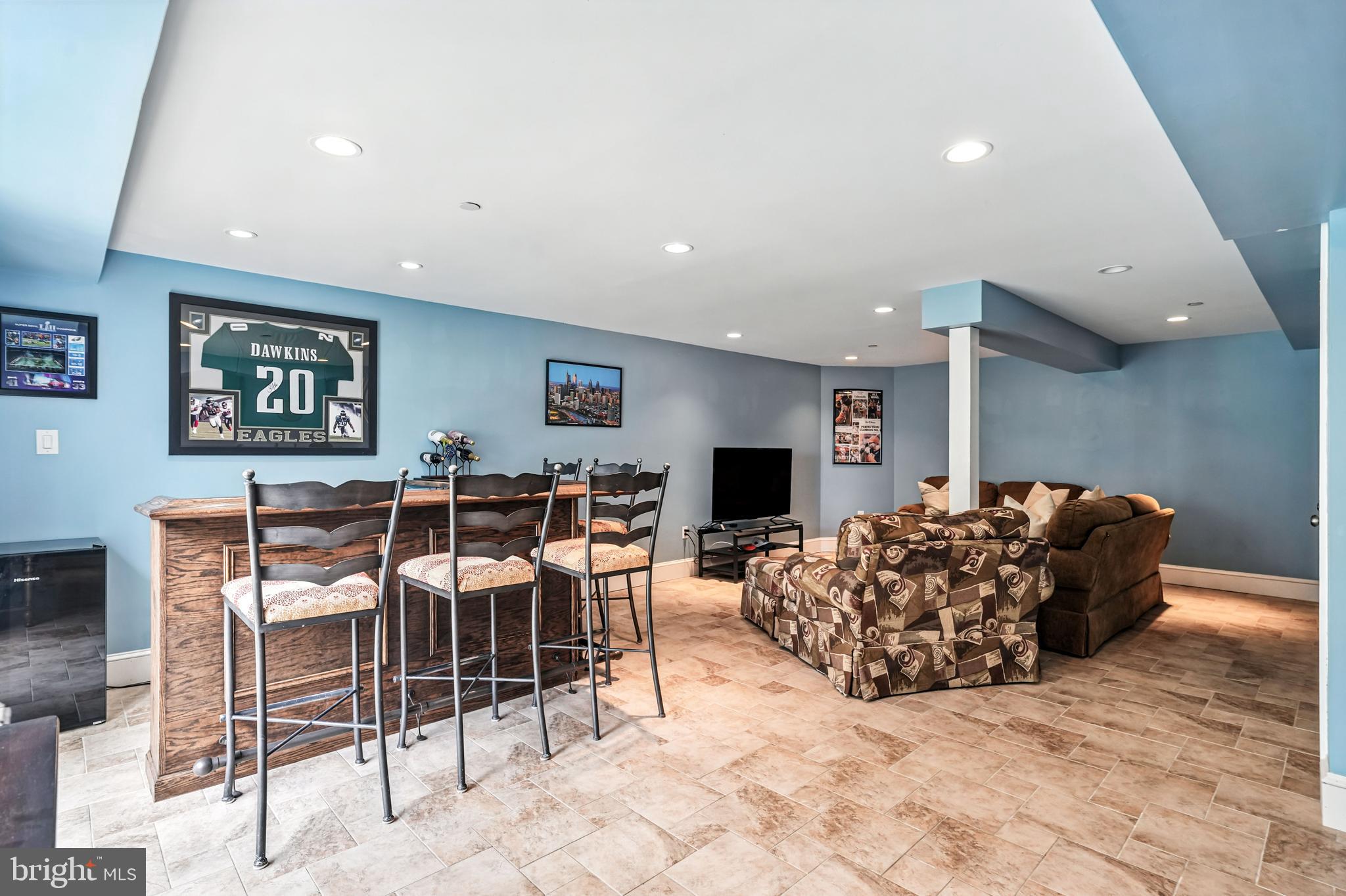 1501 Deborah Court, Unit 2102 Jamison, PA 18929 - Photo 16 of 21 a living room with furniture a flat screen tv and a table
