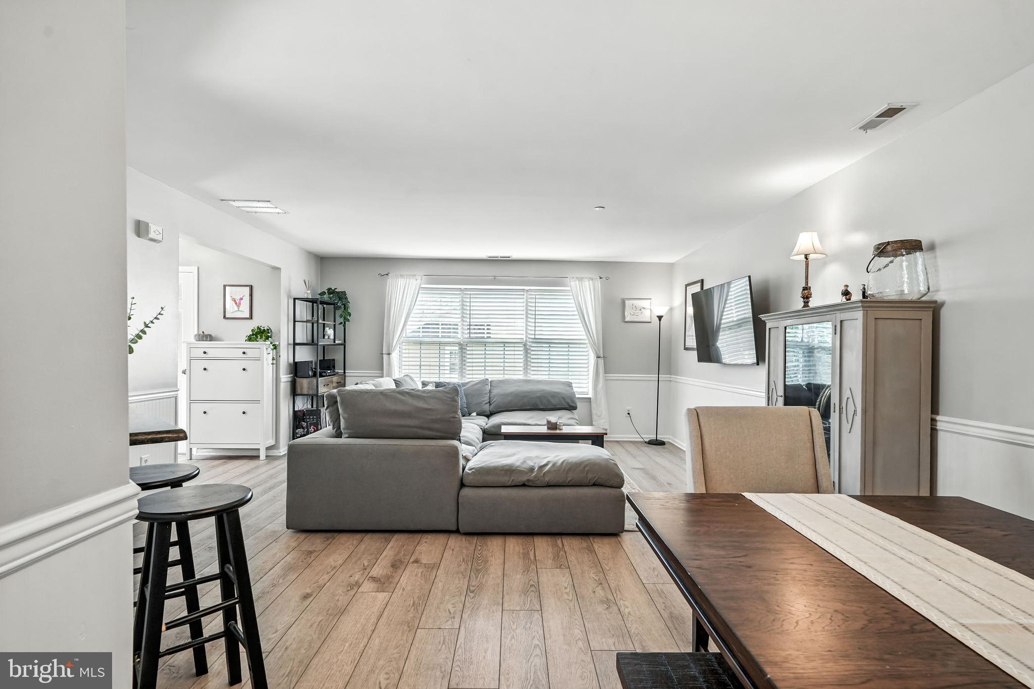 1501 Deborah Court, Unit 2102 Jamison, PA 18929 - Photo 6 of 21 a living room with furniture and a wooden floor