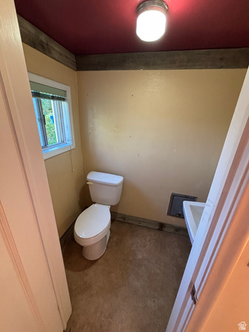 102 South Main Street Paris, ID 83261 - Photo 26 of 33 Bathroom with toilet and baseboards