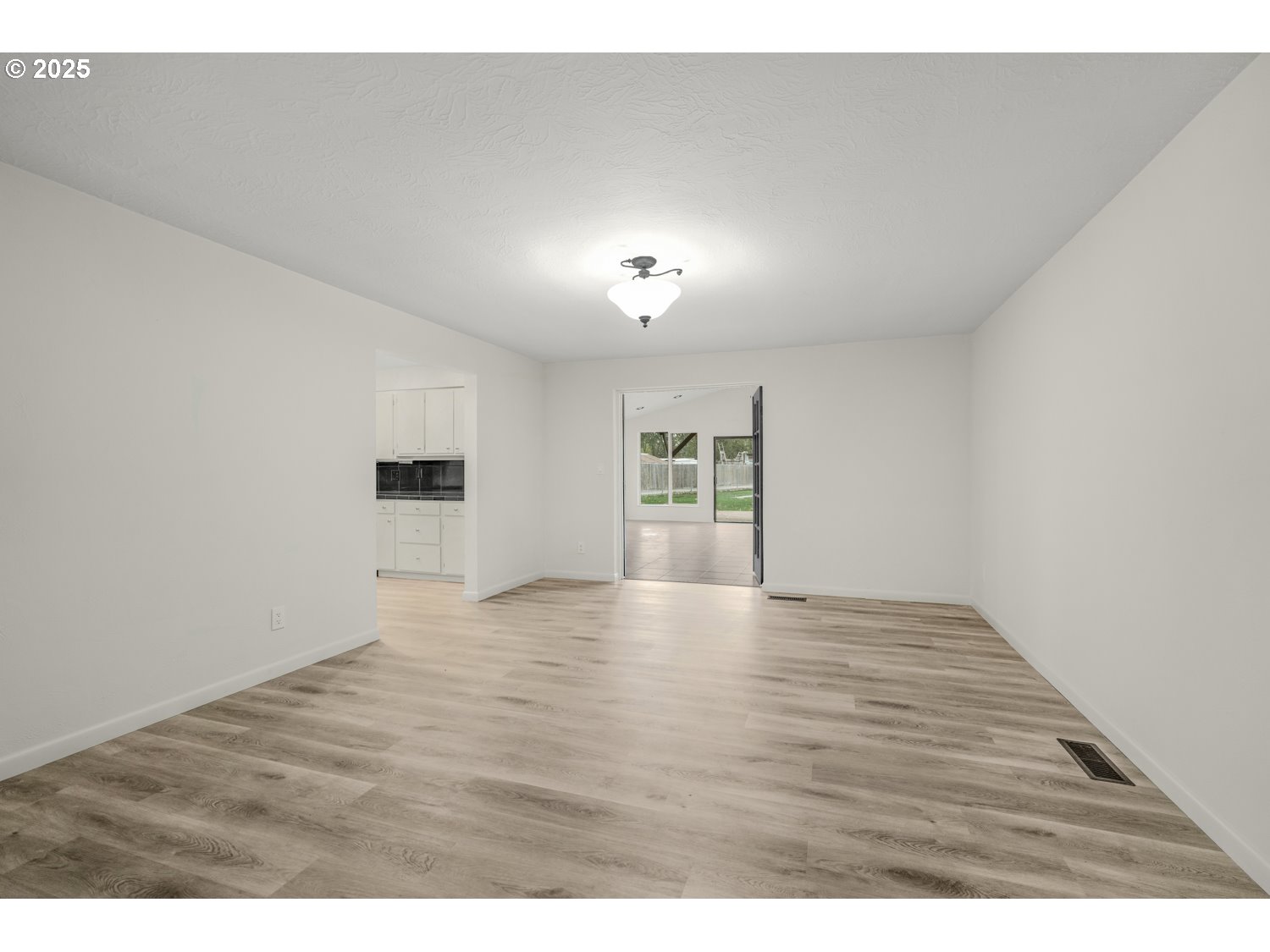 4160 Cordon Road Northeast Salem, OR 97305 - Photo 8 of 43 a view of an empty room with a window and wooden floor