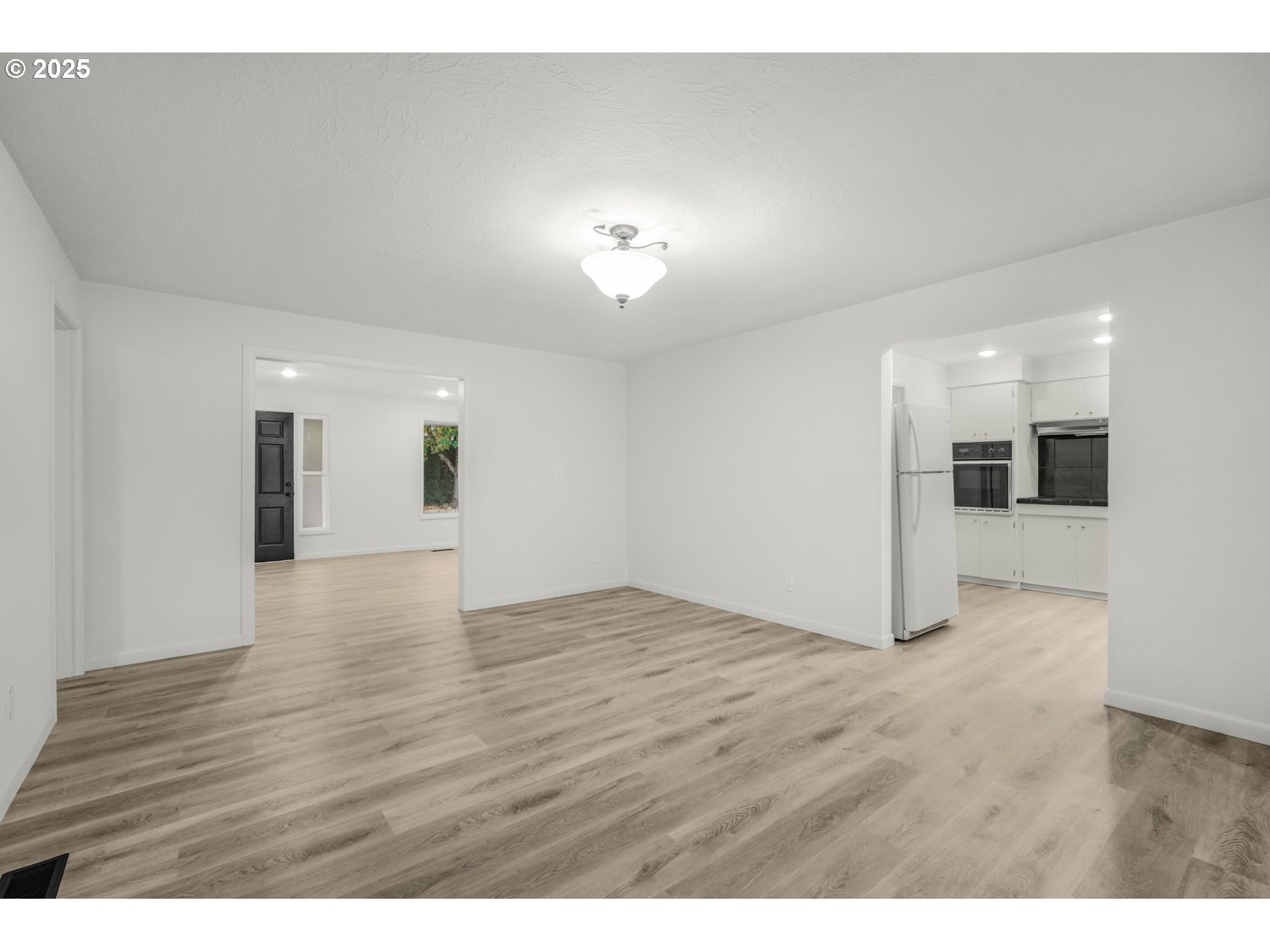 4160 Cordon Road Northeast Salem, OR 97305 - Photo 9 of 43 a view of an empty room with wooden floor