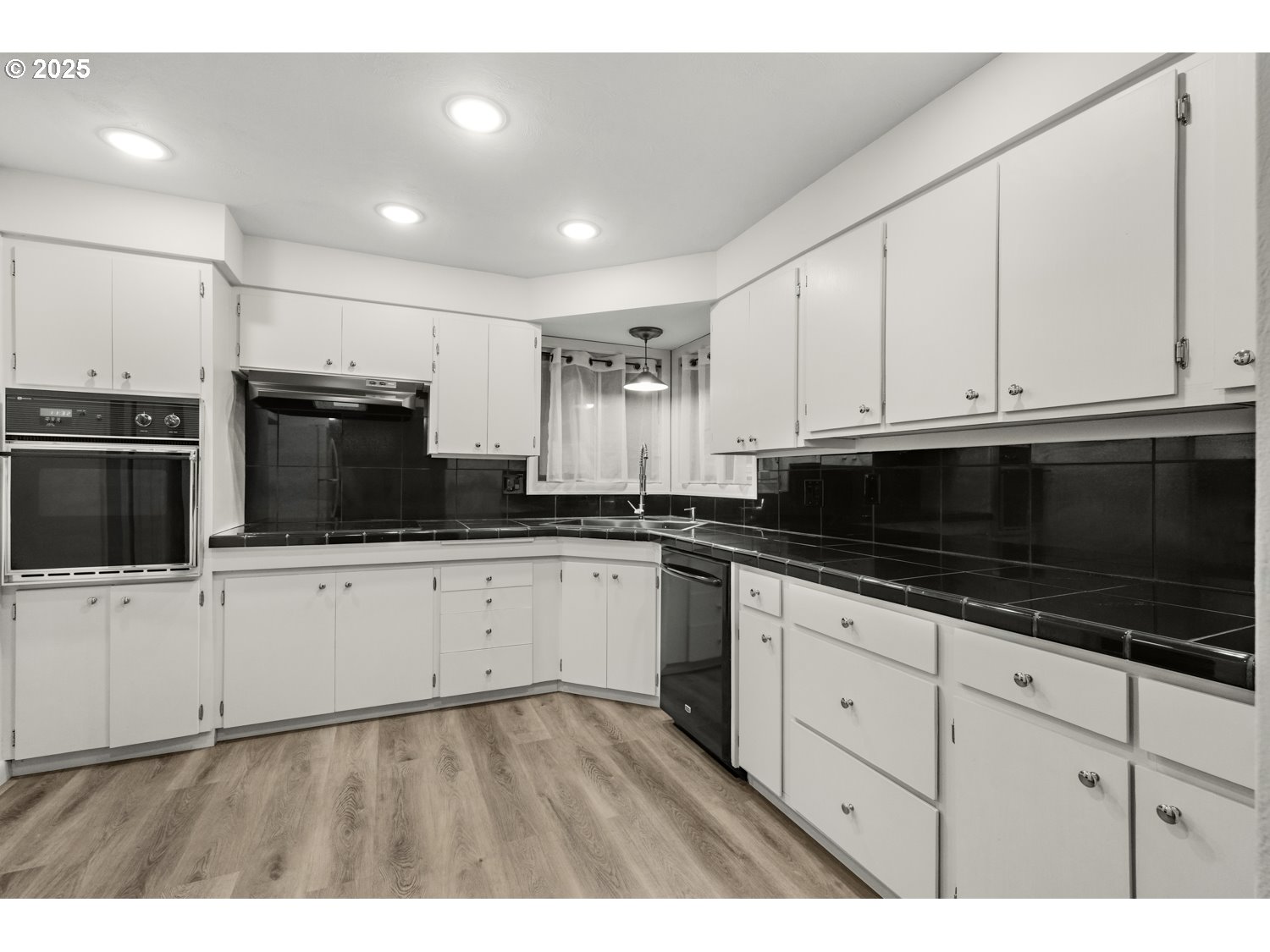 4160 Cordon Road Northeast Salem, OR 97305 - Photo 10 of 43 a kitchen with granite countertop white cabinets stainless steel appliances and sink