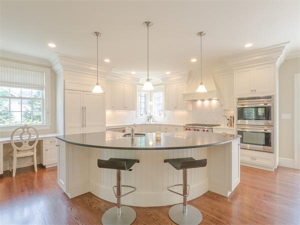 79 Pilgrim Road Wellesley, MA 02481 - Photo 12 of 30 a kitchen with kitchen island granite countertop a dining table chairs and sink