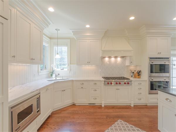 79 Pilgrim Road Wellesley, MA 02481 - Photo 13 of 30 a kitchen with stainless steel appliances granite countertop a stove a sink and a refrigerator