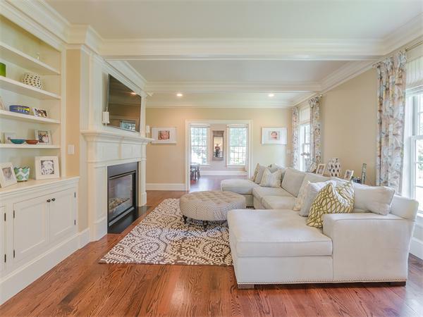 79 Pilgrim Road Wellesley, MA 02481 - Photo 14 of 30 a living room with furniture a fireplace and a flat screen tv